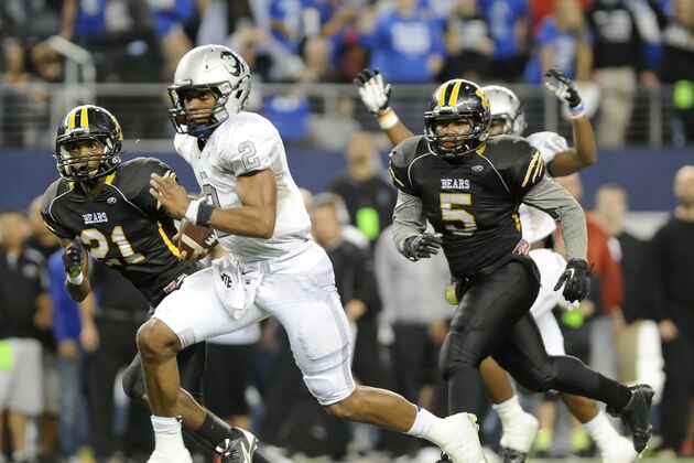 Denton Guyer Jerrod Heard (2) runs upfield past Northside Brennan's Llandre Mitchell (21) and DJ Allen (5) for a second half of the UIL Class 4A Division I high school football championship game, Friday Dec. 20, 2013, in Arlington, Texas. (AP Photo/Matt Strasen)