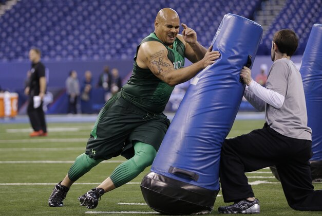 Washington State defensive lineman Xavier Cooper runs a drill at the NFL football scouting combine in Indianapolis, Sunday, Feb. 22, 2015. (AP Photo/David J. Phillip)