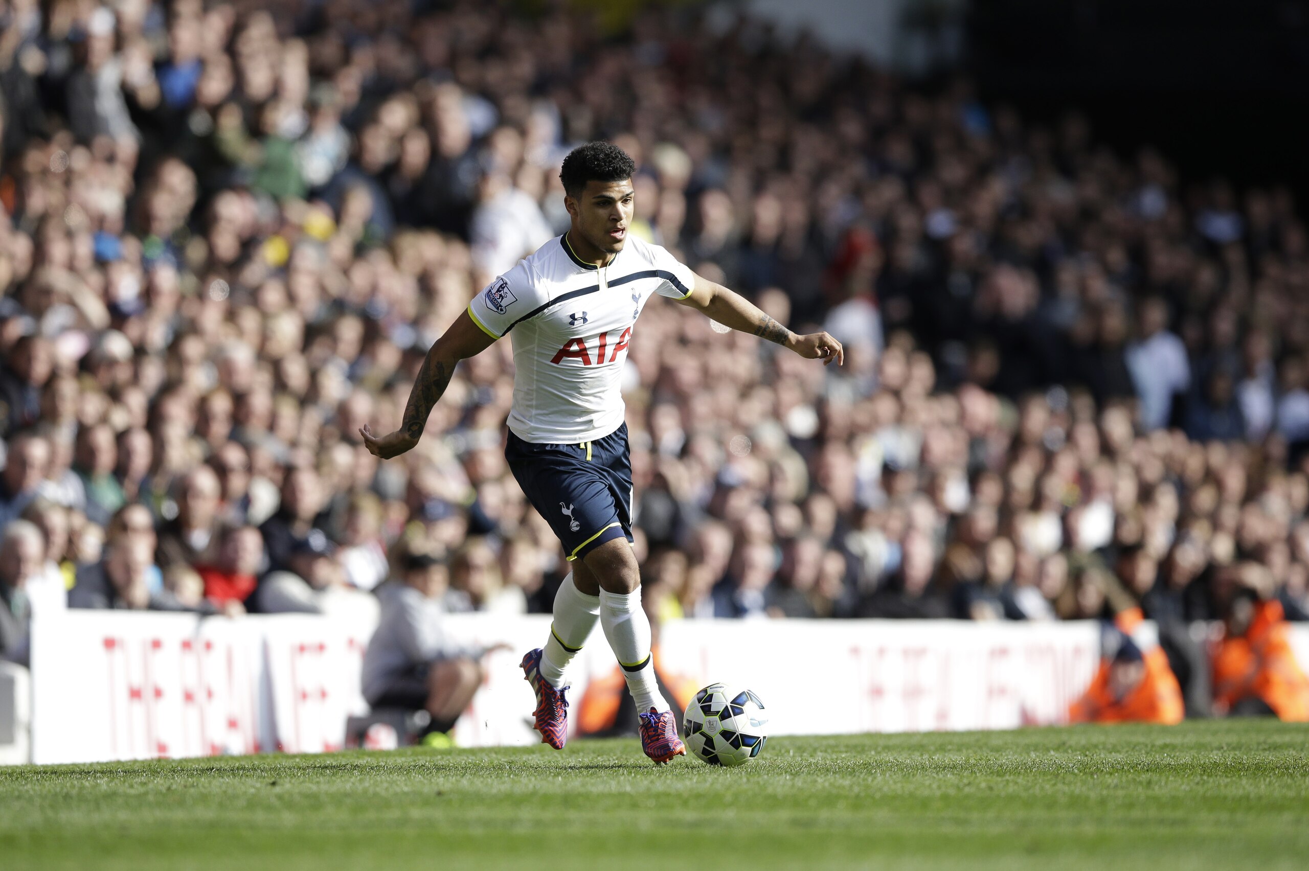 Tottenham Hotspur's DeAndre Yedlin from the U.S. runs with the ball after coming off the substitute's bench to make his debut during the English Premier League soccer match between Tottenham Hotspur and Aston Villa at White Hart Lane stadium in London, Saturday, April 11, 2015.  (AP Photo/Matt Dunham)