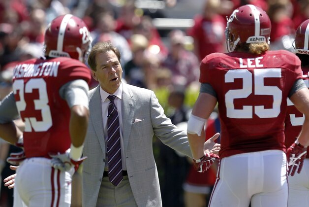 Alabama coach Nick Saban reacts to a breakdown with defensive players Alabama defensive back Jabriel Washington (23) and linebacker Dillon Lee (25) during Alabama's A-Day NCAA college football spring game Saturday, April 19, 2014, in Tuscaloosa, Ala. (AP Photo/Butch Dill)