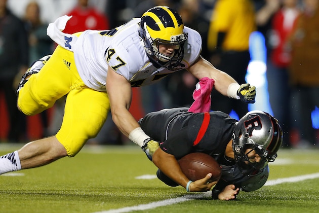 Rutgers quarterback Gary Nova (10) is sacked by Michigan's Jake Ryan (47) during the second half of an NCAA college football game Saturday, Oct. 4, 2014, in Piscataway, N.J. Rutgers defeated Michigan 26-24. (AP Photo/Rich Schultz)