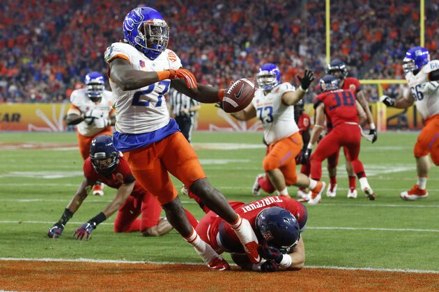 Boise State running back Jay Ajayi (27) scores a touchdown against Arizona during the first half of the Fiesta Bowl NCAA college football game, Wednesday, Dec. 31, 2014, in Glendale, Ariz. (AP Photo/Ross D. Franklin)