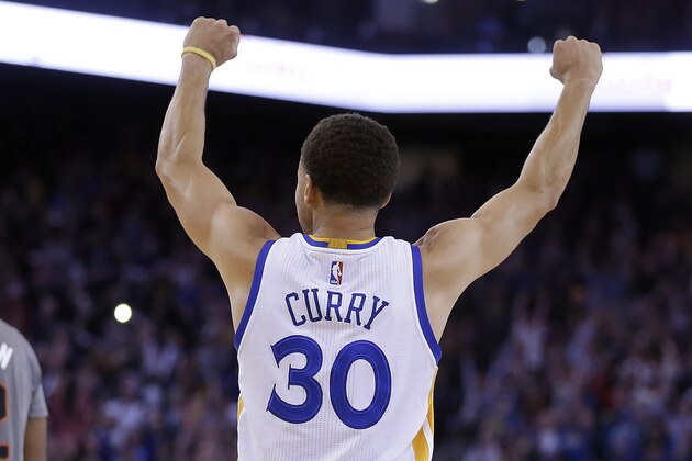 Golden State Warriors' Stephen Curry (30) celebrates at the end of an NBA basketball game against the Phoenix Suns on Thursday, April 2, 2015, in Oakland, Calif. The Warriors won 107-106. (AP Photo/Ben Margot)