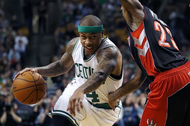 Boston Celtics' Isaiah Thomas (4) drives past Toronto Raptors' Louis Williams (23) during the first quarter of an NBA basketball game in Boston, Tuesday, April 14, 2015. (AP Photo/Michael Dwyer)