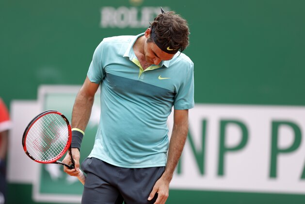 Roger Federer of Switzerland reacts during his match of the Monte Carlo Tennis Masters tournament against Gael Monfils of France, in Monaco, Thursday, April 16, 2015. Federer was defeated by Monfils. (AP Photo/Lionel Cironneau)