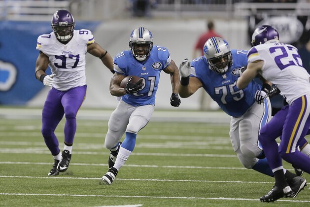 Detroit Lions guard Larry Warford (75) blocks Minnesota Vikings free safety Harrison Smith (22) for Detroit Lions running back Reggie Bush (21) as Minnesota Vikings defensive end Everson Griffen (97) gives pursuit during the first half of an NFL football game at Ford Field in Detroit, Sunday, Dec. 14, 2014. (AP Photo/Duane Burleson)
