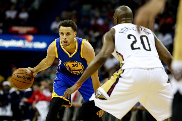 Apr 7, 2015; New Orleans, LA, USA; Golden State Warriors guard Stephen Curry (30) is guarded by New Orleans Pelicans guard Quincy Pondexter (20) during the first quarter of a game at the Smoothie King Center. Mandatory Credit: Derick E. Hingle-USA TODAY Sports
