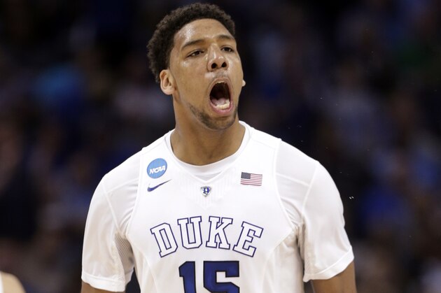 Duke's Jahlil Okafor (15) celebrates after a dunk against San Diego State during the first half of an NCAA tournament college basketball game in the Round of 32 in Charlotte, N.C., Sunday, March 22, 2015. (AP Photo/Nell Redmond)