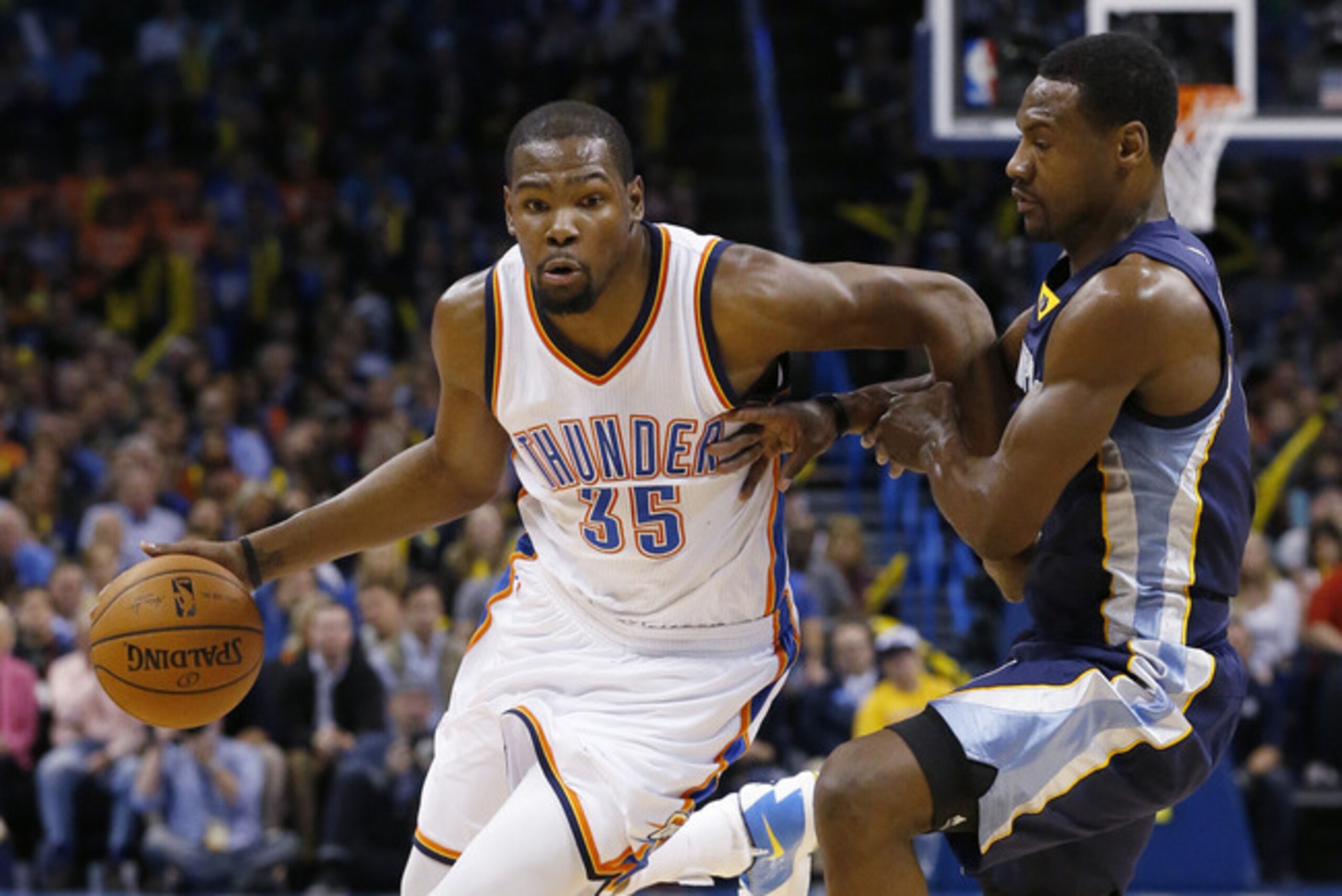 Oklahoma City Thunder forward Kevin Durant (35) drives around Memphis Grizzlies forward Tony Allen during the third quarter of an NBA basketball game in Oklahoma City, Wednesday, Feb. 11, 2015. Oklahoma City won 105-89. (AP Photo/Sue Ogrocki)