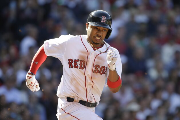 Boston Red Sox's Mookie Betts runs toward first base in the second inning of a baseball game against the Washington Nationals, Monday, April 13, 2015, in Boston. (AP Photo/Steven Senne)