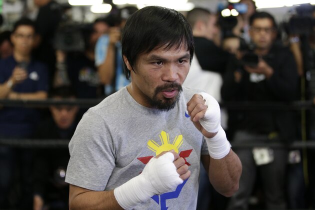 Boxer Manny Pacquiao, of the Philippines, shadow-boxes during a media workout at Wild Card Boxing Club, Wednesday, April 15, 2015, in Los Angeles. Pacquiao is scheduled to fight Floyd Mayweather Jr. in a welterweight boxing match in Las Vegas on May 2. (AP Photo/Jae C. Hong)