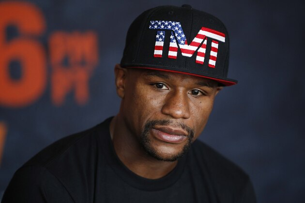 Boxer Floyd Mayweather Jr. speaks with the media before a workout Tuesday, April 14, 2015, in Las Vegas. Mayweather will face Manny Pacquiao in a welterweight boxing match in Las Vegas on May 2. (AP Photo/John Locher)