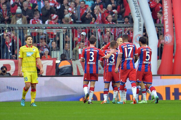 Bayern's players celebrate after scoring during the  Bundesliga  soccer match between FC Bayern Munich and 1899 Hoffenheim in the Allianz Arena in Munich, Germany, on Saturday, Nov. 22, 2014. (AP Photo/Kerstin Joensson)