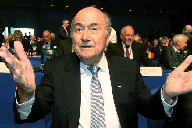 FIFA President Joseph Blatter gestures as he waits for the start of the 39th Ordinary UEFA Congress in Vienna, Austria, Tuesday, March 24, 2015. Blatter hit out at unnamed lawmakers for wanting boycotts of the 2018 World Cup in Russia and the 2022 event in Qatar. (AP Photo/Ronald Zak)