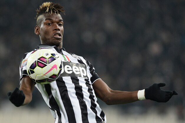Juventus'  Paul Pogba controls the ball during a Serie A soccer match between Juventus and Sassuolo at the Juventus stadium, in Turin, Italy, Monday, March 9, 2015. (AP Photo/Massimo Pinca)