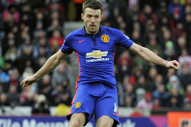 Manchester United's Michael Carrick during their English Premier League soccer match against Stoke City at the Britannia Stadium in Stoke on Trent, England, Thursday Jan. 1, 2015. (AP Photo/Clint Hughes)