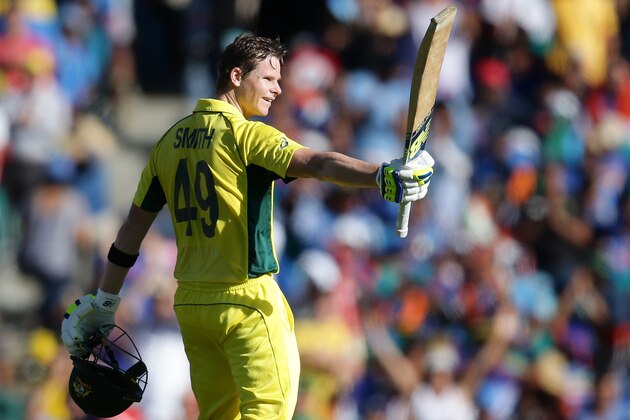 Australia's Steve Smith celebrates after scoring  a century while batting against India during their Cricket World Cup semifinal in Sydney, Australia, Thursday, March 26, 2015. (AP Photo/Rob Griffith)