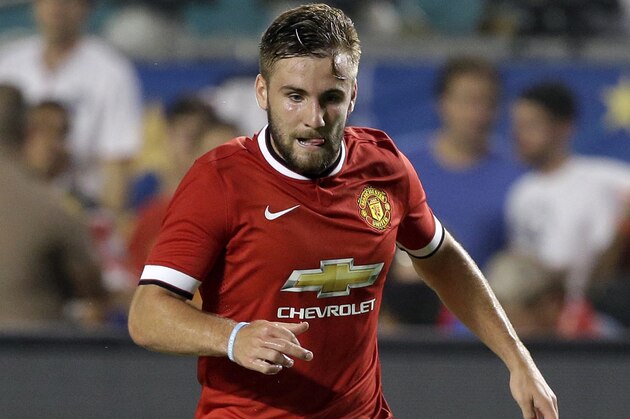 Manchester United's Luke Shaw runs with the ball in the first half during the final of the Guinness International Champions Cup soccer match against Liverpool, Monday, Aug. 4,  2014, in Miami Gardens, Fla. (AP Photo/Lynne Sladky)