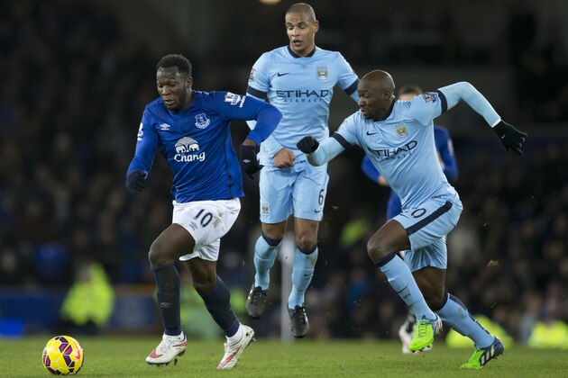 Everton's Romelu Lukaku, left, keeps the ball from Manchester City's Eliaquim Mangala, right, as Fernando looks on during the English Premier League soccer match between Everton and Manchester City at Goodison Park Stadium, Liverpool, England, Saturday Jan. 10, 2015. (AP Photo/Jon Super)