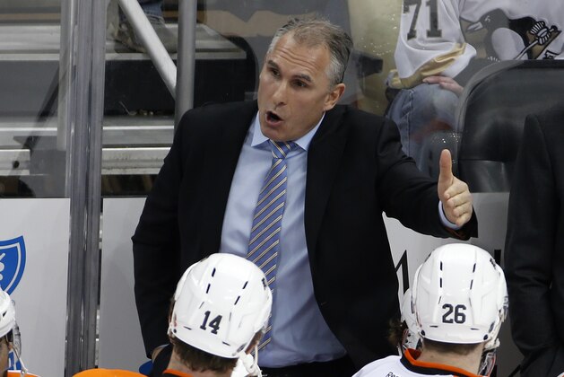 Philadelphia Flyers head coach Craig Berube gives instructions during a timeout in the third period of an NHL hockey game against the Pittsburgh Penguins in Pittsburgh Wednesday, April 1, 2015. The Flyers won 4-1.  (AP Photo/Gene J. Puskar)