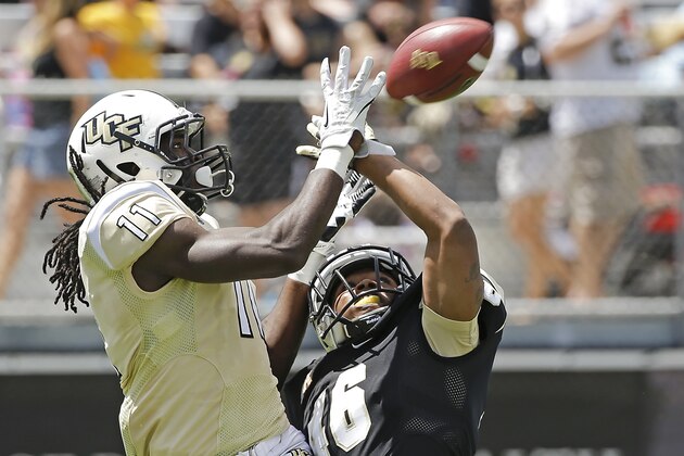 Central Florida defensive back Jamonte Jones (46) breaks up a pass intended for wide receiver Breshad Perriman (11) during their spring NCAA college football game in Orlando, Fla., Saturday, April 12, 2014. (AP Photo/John Raoux)
