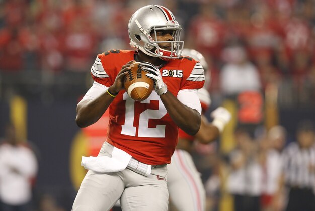 Jan 12, 2015; Arlington, TX, USA; Ohio State Buckeyes quarterback Cardale Jones (12) in action against the Oregon Ducks in the 2015 CFP National Championship Game against the Oregon Ducks at AT&T Stadium. Mandatory Credit: Matthew Emmons-USA TODAY Sports