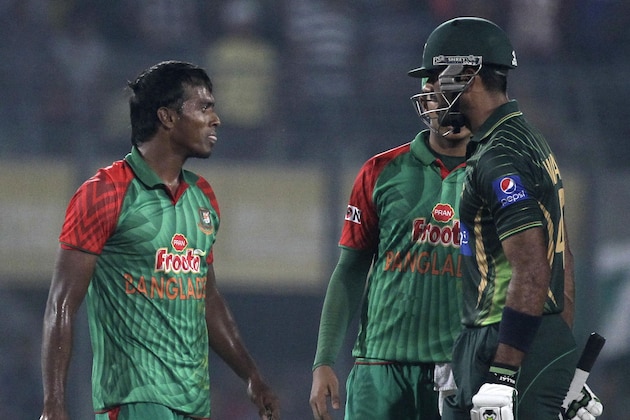 Bangladeshi Rubel Hossain, left, and Pakistan’s Wahab Riaz, right, get into an altercation after the dismissal of the latter during their first one-day international cricket match in Dhaka, Bangladesh, Friday, April 17, 2015. (AP Photo/ A.M. Ahad)