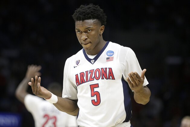 Arizona forward Stanley Johnson reacts while playing Xavier during the second half of a college basketball regional semifinal in the NCAA Tournament, Thursday, March 26, 2015, in Los Angeles. (AP Photo/Jae C. Hong)