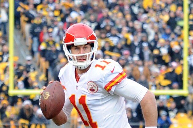 Kansas City Chiefs quarterback Alex Smith (11) scrambles out of the pocket during the first half of an NFL football game in Pittsburgh, Sunday, Dec. 21, 2014. (AP Photo/Don Wright)