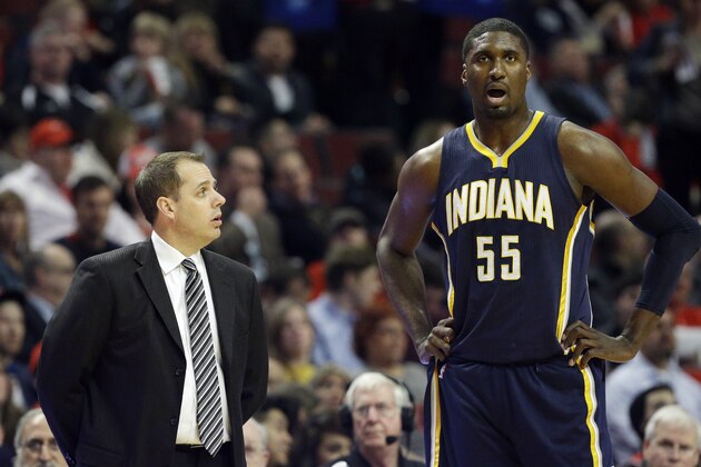 Indiana Pacers head coach Frank Vogel, left, talks to center Roy Hibbert during the first half of an NBA basketball game against the Chicago Bulls in Chicago on Wednesday, March 18, 2015. (AP Photo/Nam Y. Huh)
