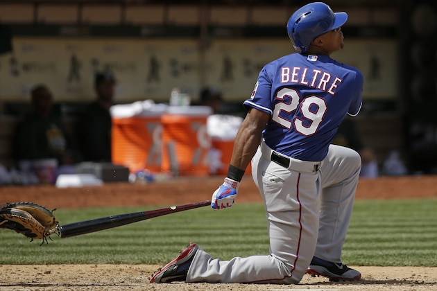 Texas Rangers' Adrian Beltre hits a home run off Oakland Athletics relief pitcher Evan Scribner in the seventh inning of their baseball game Thursday, April 9, 2015, in Oakland, Calif. (AP Photo/Eric Risberg)