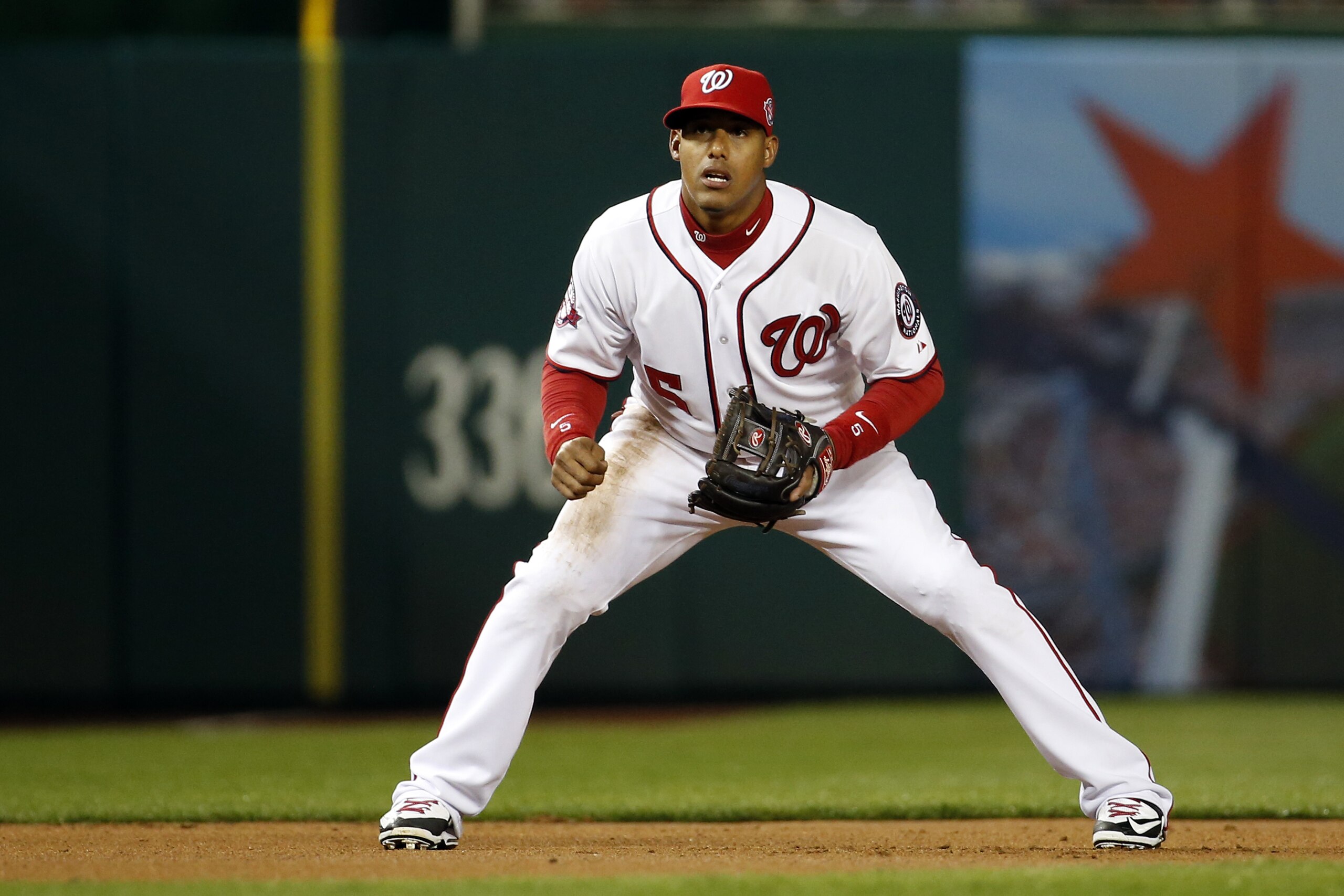 Washington Nationals third baseman Yunel Escobar (5) stands ready during the first inning of a baseball game against the New York Mets at Nationals Park, Wednesday, April 8, 2015, in Washington. (AP Photo/Alex Brandon)