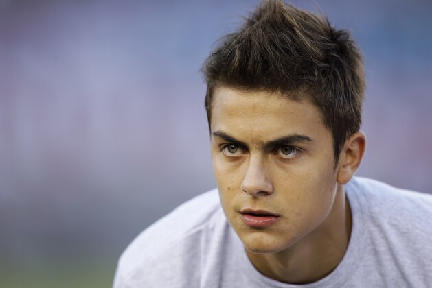 Instituto's Paulo Dybala posses for the team picture before an Argentina's second division league soccer match against River Plate in Buenos Aires, Argentina, Saturday, April 21, 2012. (AP Photo/Natacha Pisarenko)