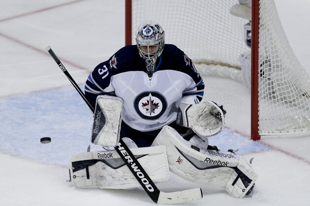 Winnipeg Jets goalie Ondrej Pavelec blocks a shot against the Anaheim Ducks during the second period of Game 1 of a first-round NHL hockey playoff series in Anaheim, Calif., Thursday, April 16, 2015. (AP Photo/Chris Carlson)