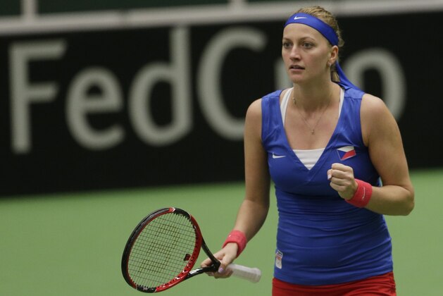 Petra Kvitova from Czech Republic reacts after winning a point against Kristina Mladenovic from France during the Fed Cup tennis semifinal match in Ostrava, Czech Republic, Saturday, April 18, 2015. (AP Photo/Petr David Josek)
