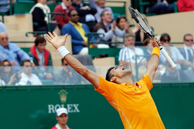 Novak Djokovic of Serbia celebrates after defeating Rafael Nadal of Spain, during their semifinal match of the Monte Carlo Tennis Masters tournament, in Monaco, Saturday, April, 18, 2015. (AP Photo/Claude Paris)