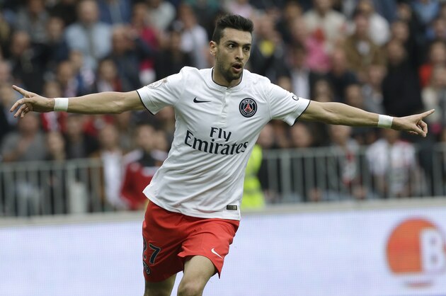 PSG's Javier Pastore reacts after scoring the first goal against Nice in their French League One soccer match, Saturday, April 18, 2015, in Nice stadium, southeastern France. (AP Photo/Lionel Cironneau)