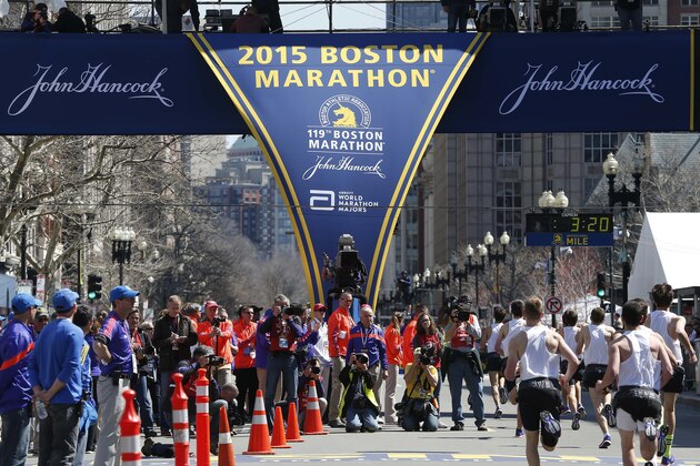 Runners compete in the boys scholastic mile as part of Boston Marathon weekend activities in Boston, Saturday, April 18, 2015. The 119th Boston Marathon will be run on Monday. (AP Photo/Michael Dwyer)