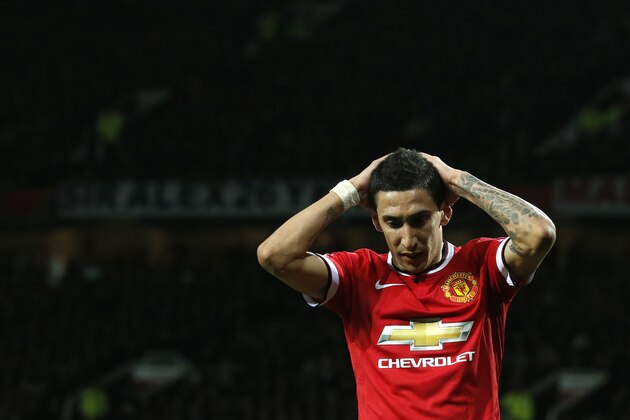 Manchester United’s Angel Di Maria holds his hands to his head after missing a chance to score a goal during the English FA Cup quarterfinal soccer match between Manchester United and Arsenal at Old Trafford Stadium, Manchester, England, Monday March 9, 2015. (AP Photo/Jon Super)