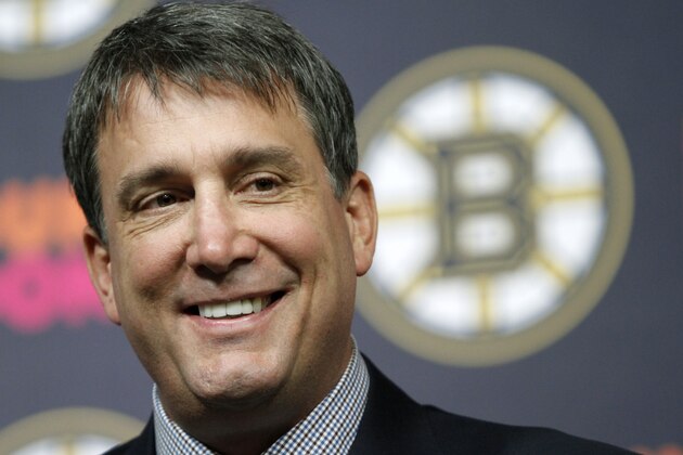 Cam Neeley smiles at news conference where he was introduced as the new president of the Boston Bruins hockey club, Wednesday, June 16, 2010, Boston. (AP Photo/Steven Senne)