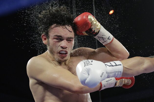 Julio Cesar Chavez Jr., left, and Bryan Vera, right, during a 12-round super middleweight bout, Saturday, March 1, 2014, in San Antonio. Chavez won by decision. (AP Photo/Eric Gay)
