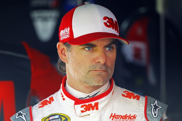 Driver Jeff Gordon stands in his pit stall during practice for a NASCAR Sprint Cup Series auto race at Bristol Motor Speedway on Saturday, April 18, 2015, in Bristol, Tenn. (AP Photo/Wade Payne)
