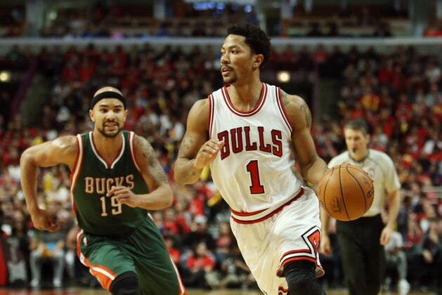 Apr 18, 2015; Chicago, IL, USA; Chicago Bulls guard Derrick Rose (1) brings the ball up ahead of Milwaukee Bucks guard Jerryd Bayless (19) during the fourth quarter in game one of the first round of the 2015 NBA Playoffs at United Center. Mandatory Credit: Jerry Lai-USA TODAY Sports