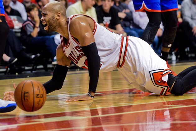 Chicago Bulls forward Taj Gibson (22) lays on the court against the Philadelphia 76ers during an NBA basketball game Saturday, April 11, 2015, in Chicago. (AP Photo/Matt Marton)