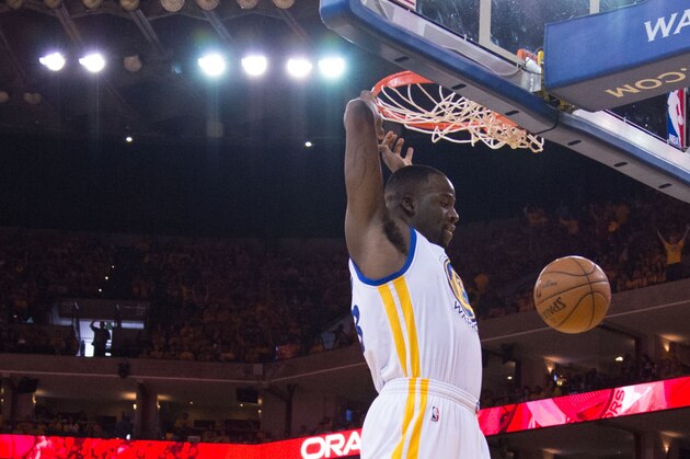 April 18, 2015; Oakland, CA, USA; Golden State Warriors forward Draymond Green (23) dunks the basketball past New Orleans Pelicans forward Ryan Anderson (33) during the third quarter in game one of the first round of the NBA Playoffs at Oracle Arena. The Warriors defeated the Pelicans 106-99. Mandatory Credit: Kyle Terada-USA TODAY Sports