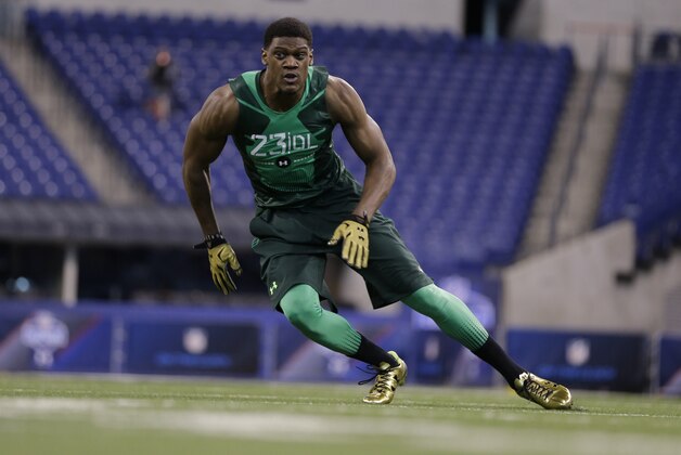 Nebraska defensive lineman Randy Gregory runs a drill at the NFL football scouting combine in Indianapolis, Sunday, Feb. 22, 2015. (AP Photo/David J. Phillip)