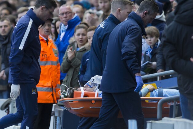 Manchester City's David Silva is carried injured from the pitch after a injury during his team's English Premier League soccer match between Manchester City and West Ham United at the Etihad Stadium, Manchester, England, Sunday April 19, 2015. (AP Photo/Jon Super)