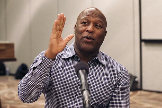 Tampa Bay Buccaneers head coach Lovie Smith answers a question as NFC football coaches meet with the media during the NFL's annual meeting, Wednesday, March 25, 2015, in Phoenix. (AP Photo/Ross D. Franklin)