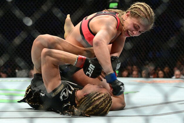 Apr 18, 2015; Newark, NJ, USA; Felice Herrig (red) and Paige VanZant (blue) fight during UFC Fight Night at Prudential Center. VanZant won via unanimous decision. Mandatory Credit: Joe Camporeale-USA TODAY Sports