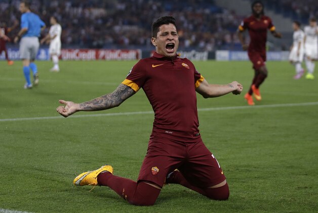 Roma's Juan Manuel Arevalos Iturbe celebrates after scoring his side's first goal during a Champions League, Group E soccer match between Roma and CSKA, at the Olympic stadium, in Rome, Wednesday, Sept. 17, 2014. (AP Photo/Alessandra Tarantino)